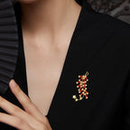 Red firecracker chest brooch